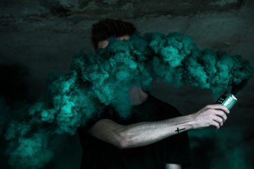 Guy-covered-in-green-smoke